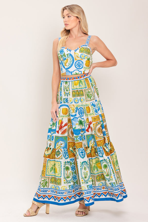 Woman wearing a printed bustier crop top with straps and smocked back bodice | Flying Tomato