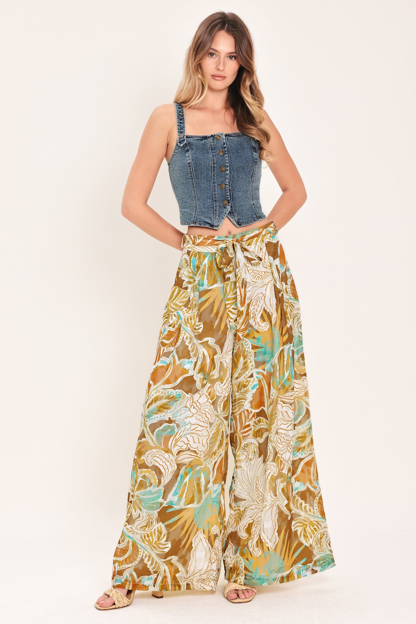 Woman wearing a denim button down crop top | Flying Tomato