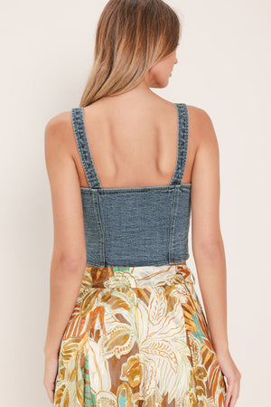 Woman wearing a denim button down crop top | Flying Tomato