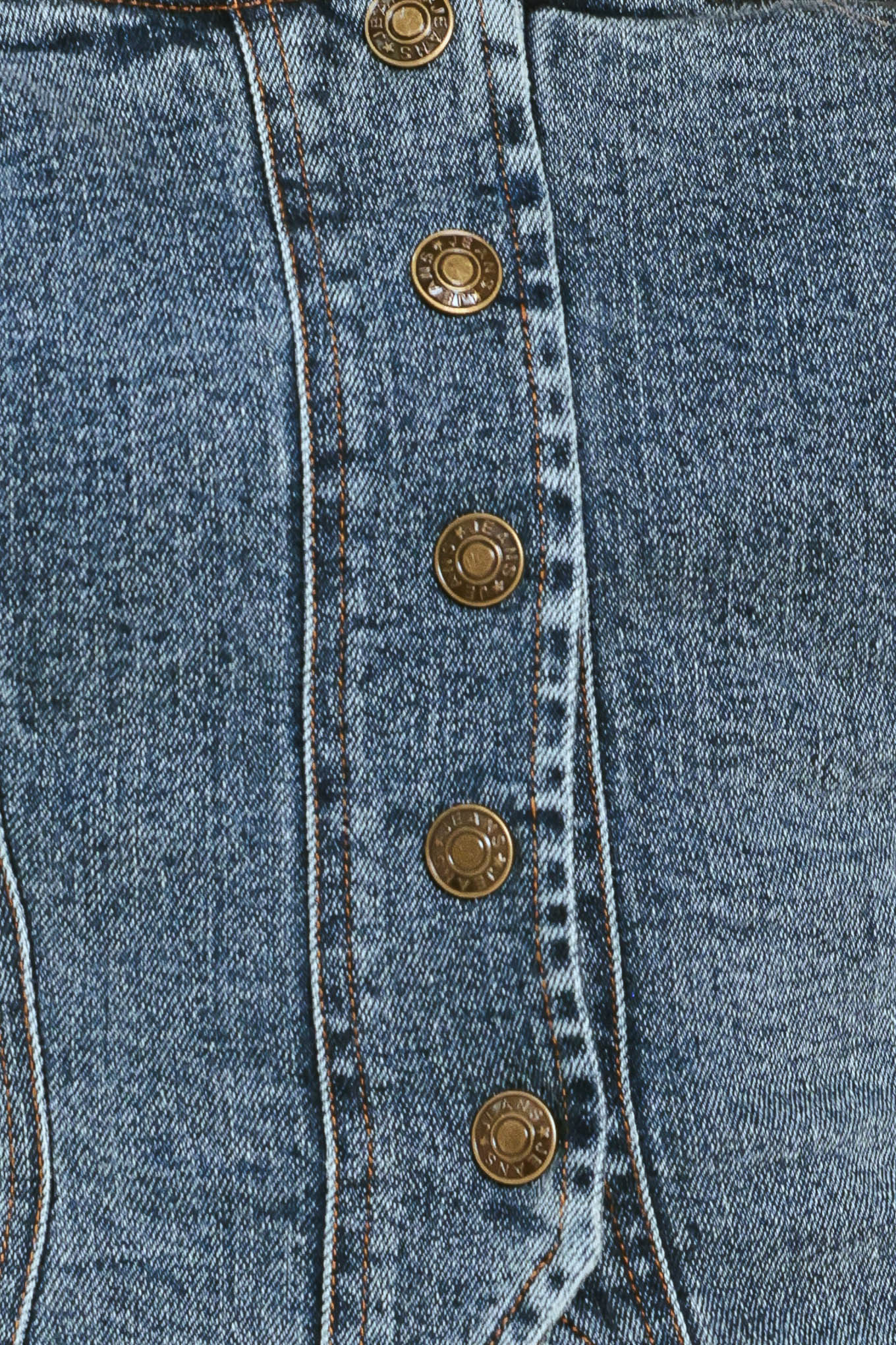 Woman wearing a denim button down crop top | Flying Tomato