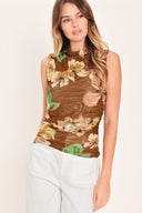 Woman wearing a brown floral sleeveless power mesh with funnel neck and side shirring | Flying Tomato
