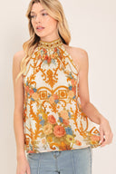Woman wearing a sleeveless floral and geometric baroque patterned top | Flying Tomato