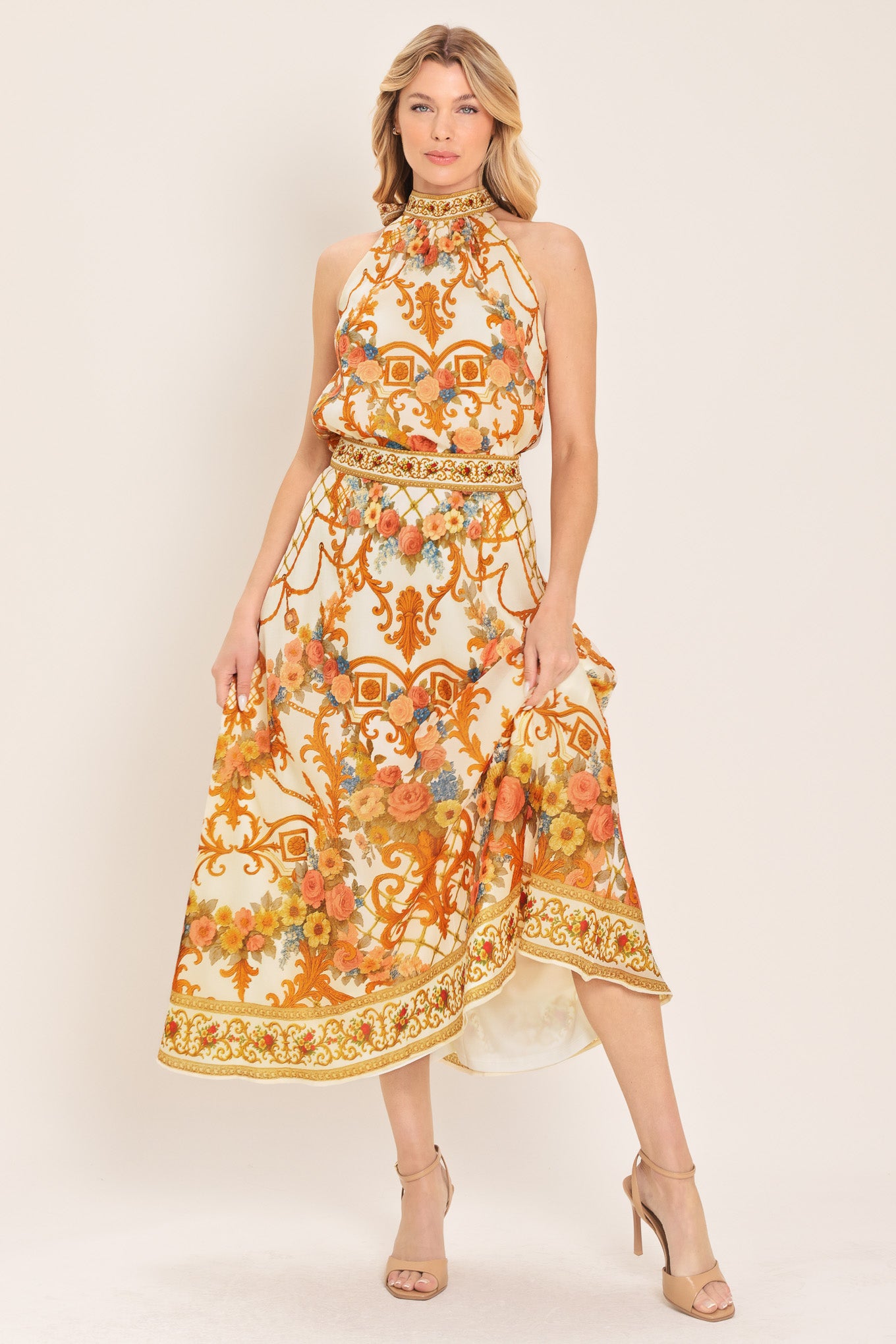 Woman wearing a sleeveless floral and geometric baroque patterned top | Flying Tomato