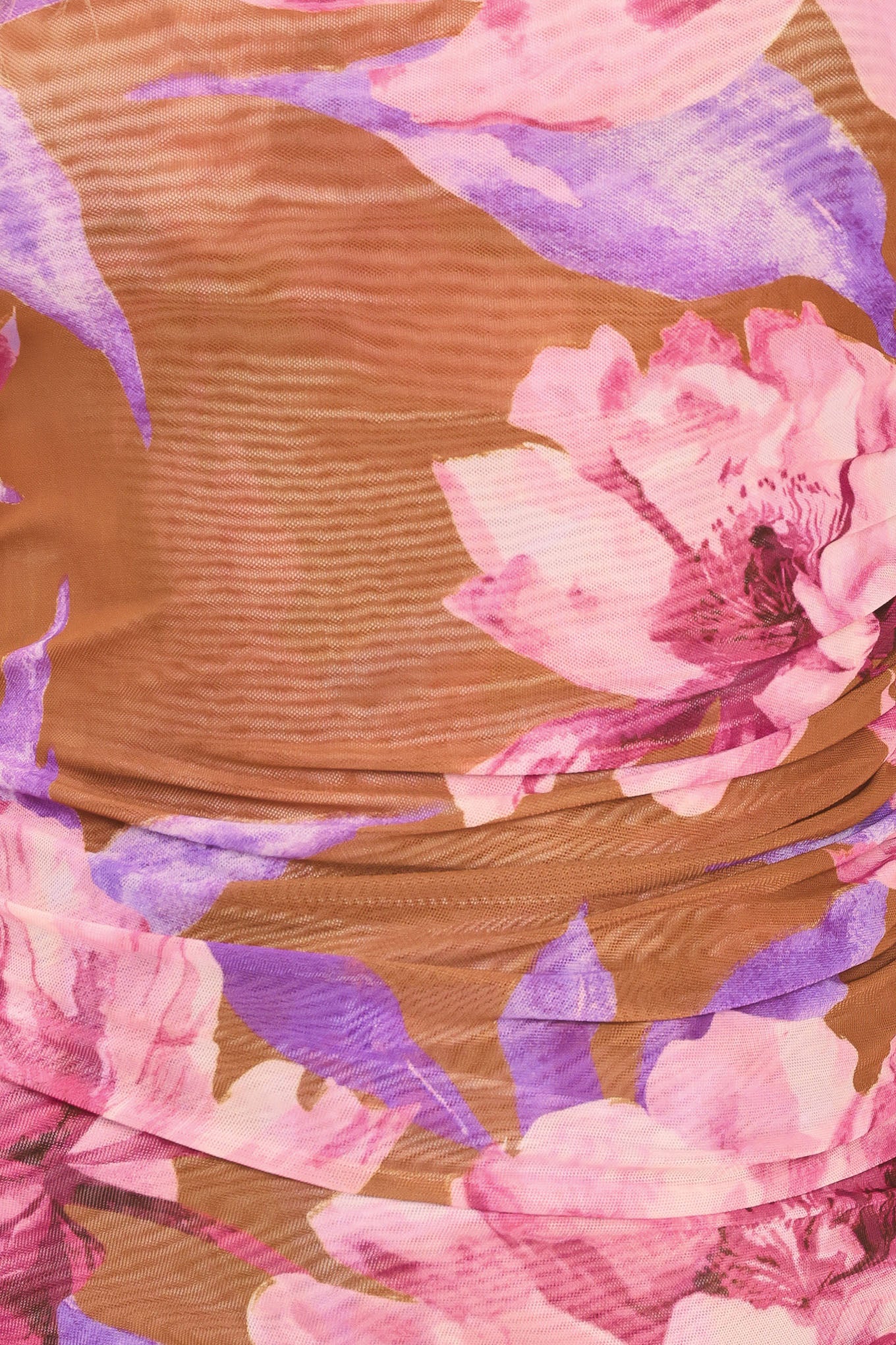 Woman wearing a floral long-sleeve power mesh brown top with pink and purple flowers | Flying Tomato