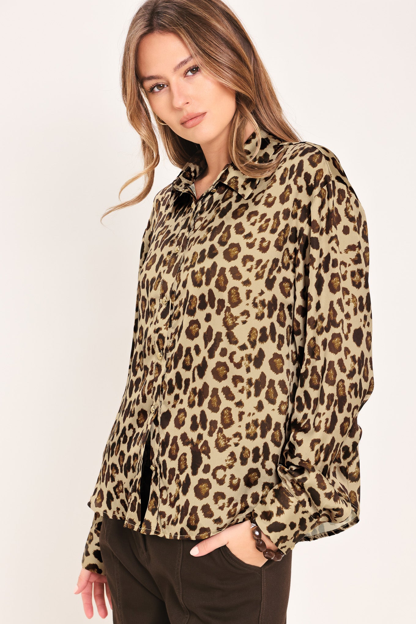 Woman wearing a long sleeve leopard print button down blouse top with collar | Flying Tomato