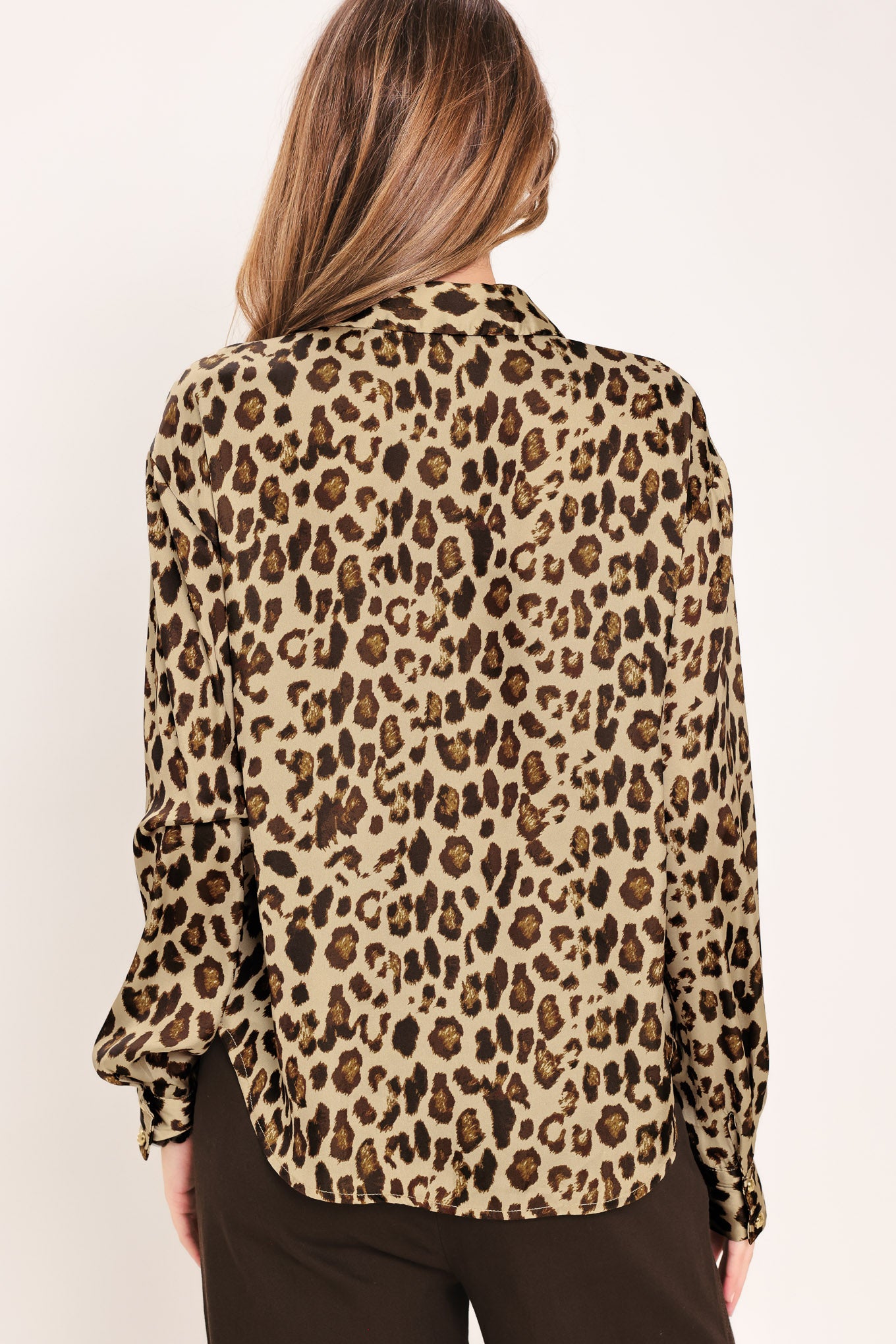 Woman wearing a long sleeve leopard print button down blouse top with collar | Flying Tomato