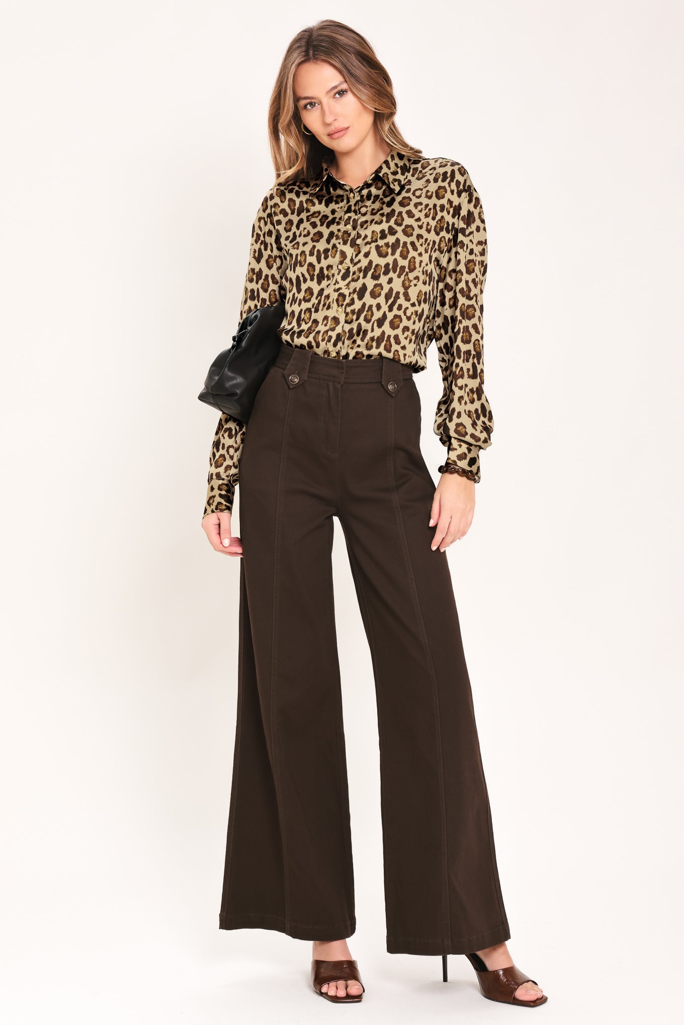 Woman wearing a long sleeve leopard print button down blouse top with collar | Flying Tomato