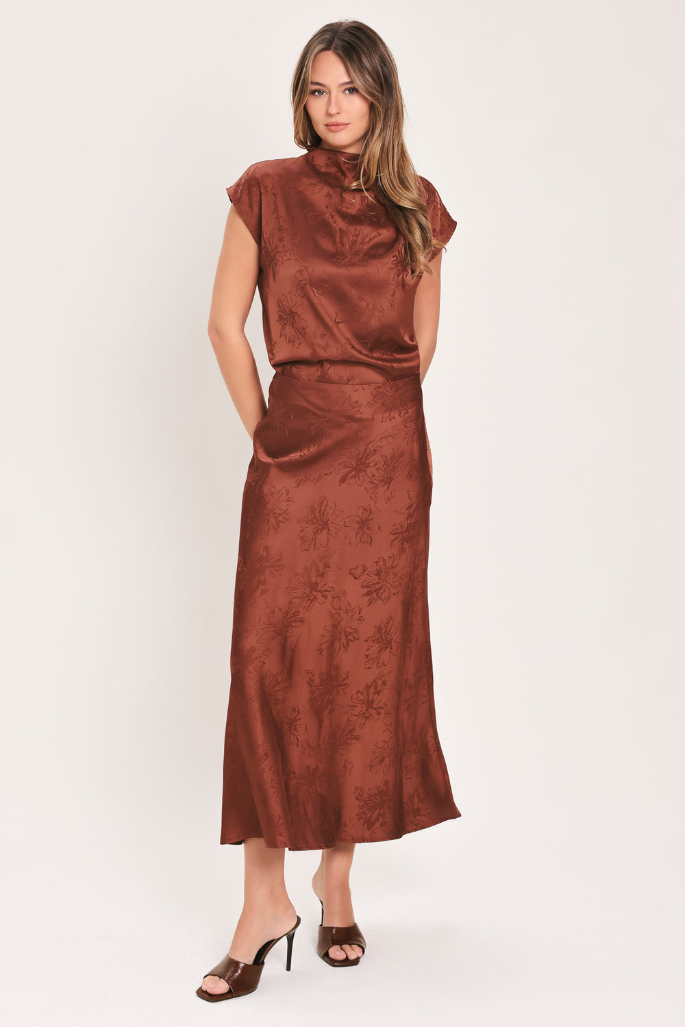 Woman wearing a cap sleeve burgundy satin jacquard top | Flying Tomato