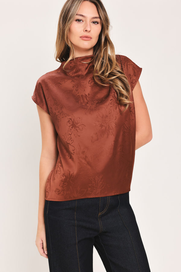Woman wearing a cap sleeve burgundy satin jacquard top | Flying Tomato
