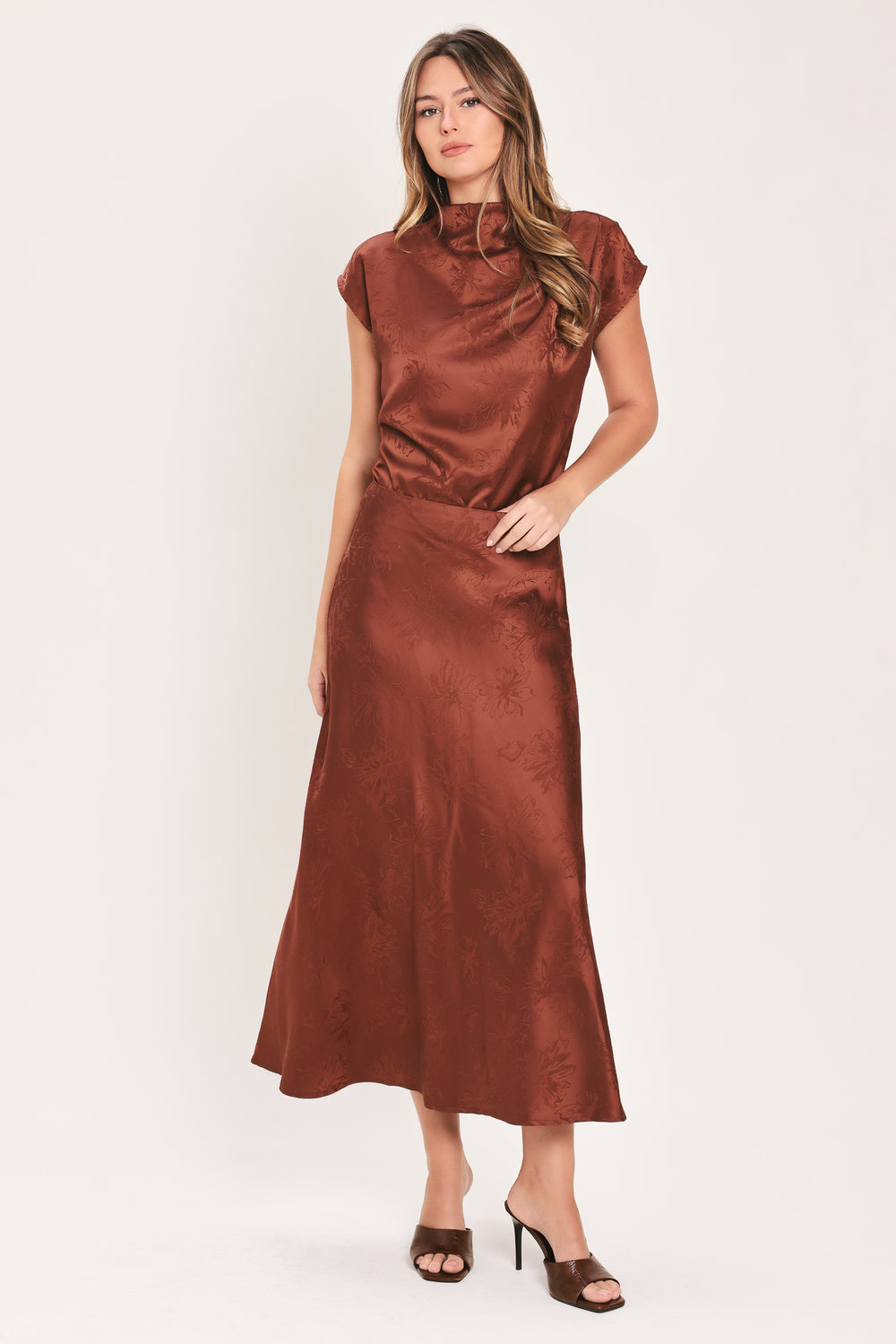 Woman wearing a cap sleeve burgundy satin jacquard top | Flying Tomato