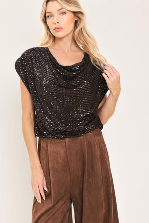 Woman wearing a cropped dark brown sequins top with a cowl neckline and overall slouchy look | Flying Tomato