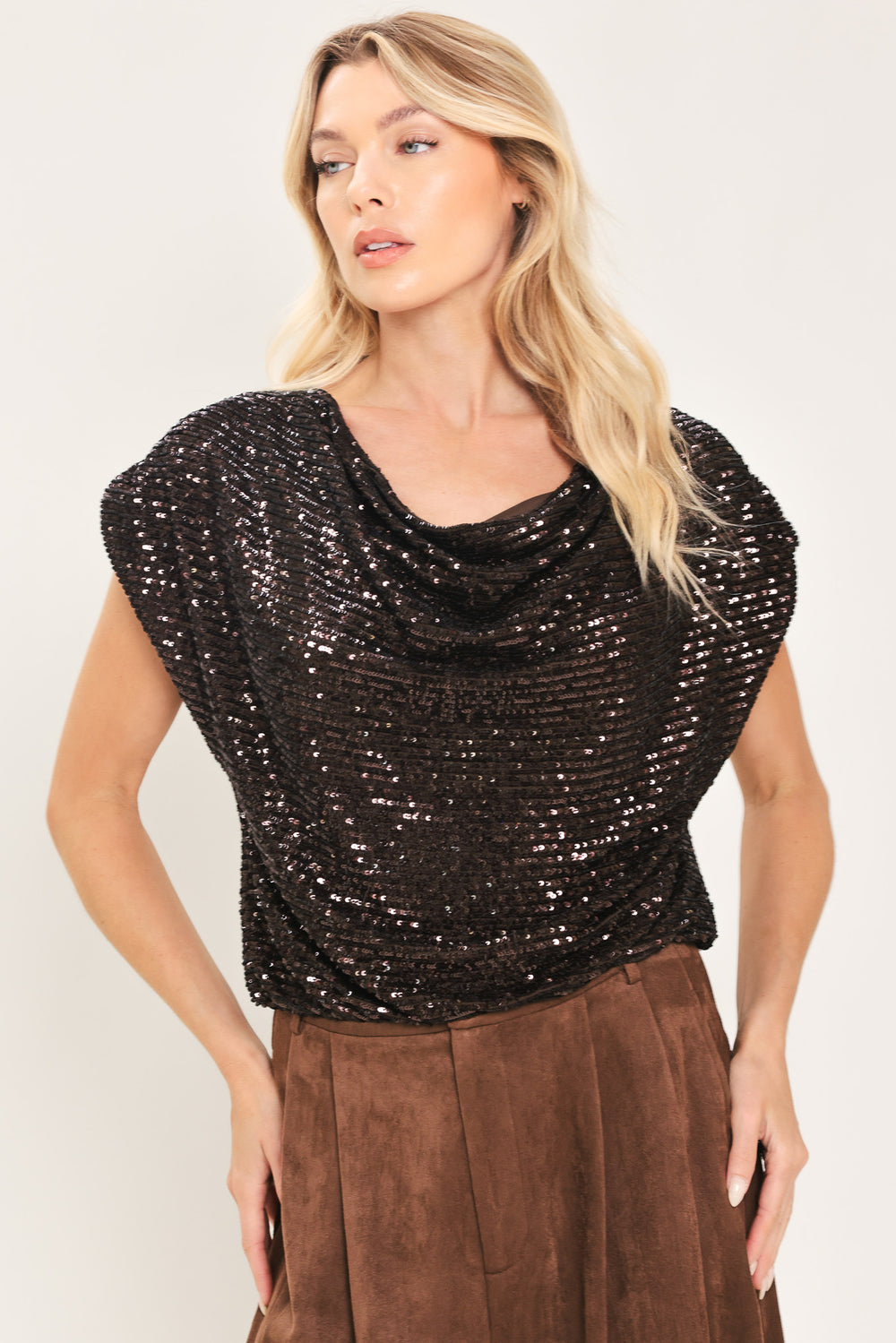 Woman wearing a cropped dark brown sequins top with a cowl neckline and overall slouchy look | Flying Tomato