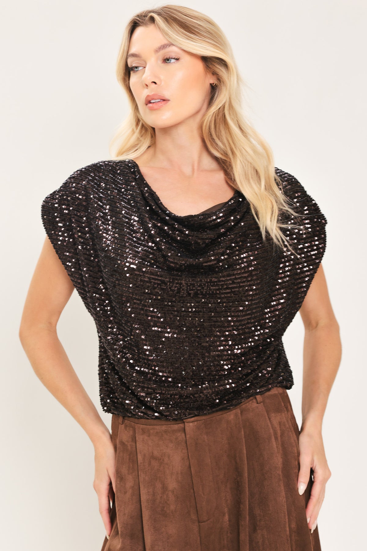 Woman wearing a cropped dark brown sequins top with a cowl neckline and overall slouchy look | Flying Tomato