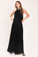 A woman modeling a sleeveless black halter top and wide leg pant set with a beaded choker neckline | Flying Tomato
