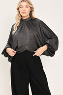 A woman modeling a dark gray metallic high-neck blouse with voluminous balloon sleeves | Flying Tomato