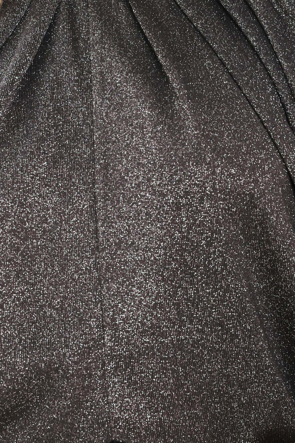 A woman modeling a dark gray metallic high-neck blouse with voluminous balloon sleeves | Flying Tomato
