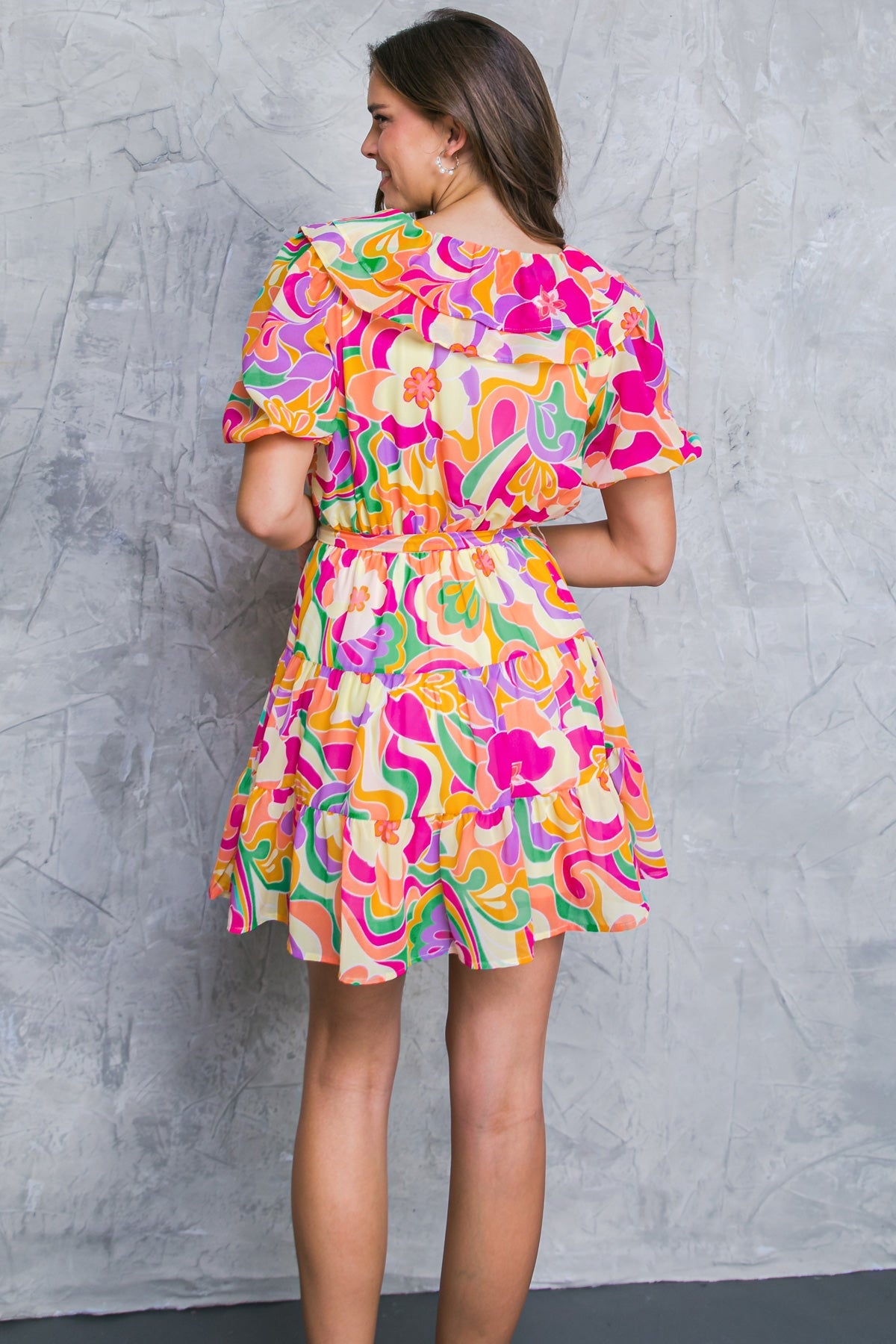 This VILLA DUCALE WOVEN MINI DRESS is the perfect party dress. Featuring a surplice neckline with ruffles, short puff sleeves, and an elasticized waist with self sash tie and tiered skirt, it provides the perfect balance of comfort and style. The classic print will make a statement at any event.