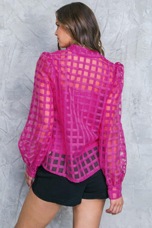 FLUTTERING ON WOVEN TOP.