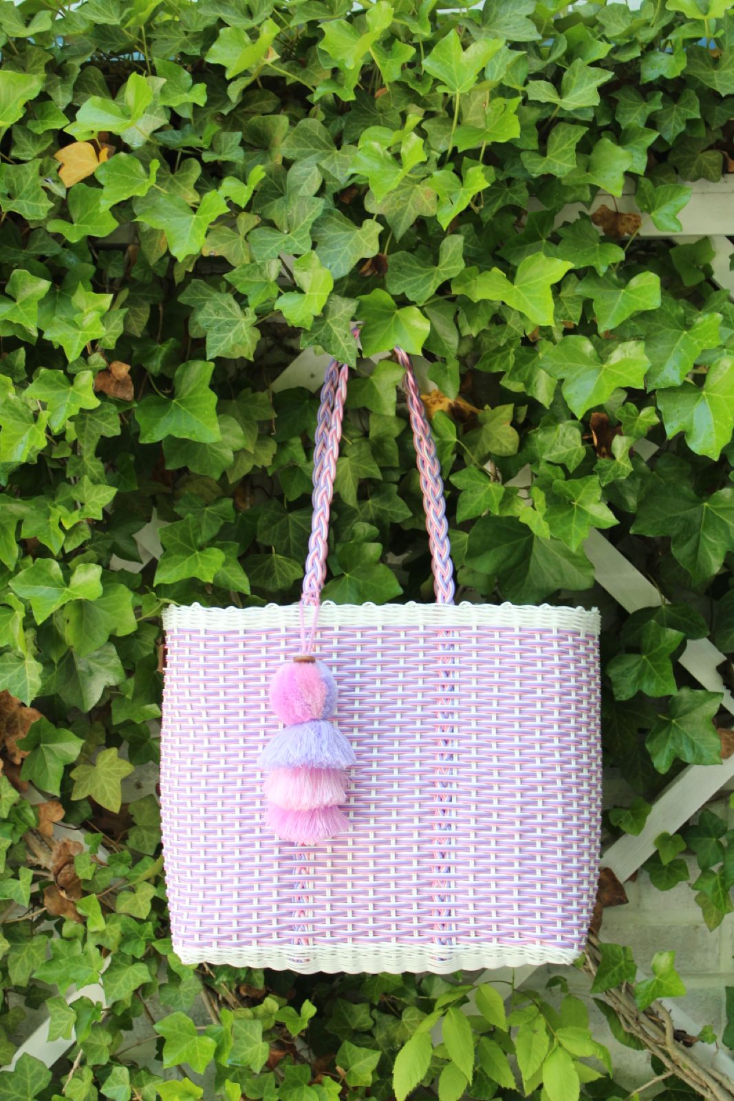 Hand crafted bags made from 100% recycled plastic. Perfect for your every day lifestyle.&nbsp;Tote comes with braided handles for a comfortable hold and lays flat on shoulder.&nbsp;