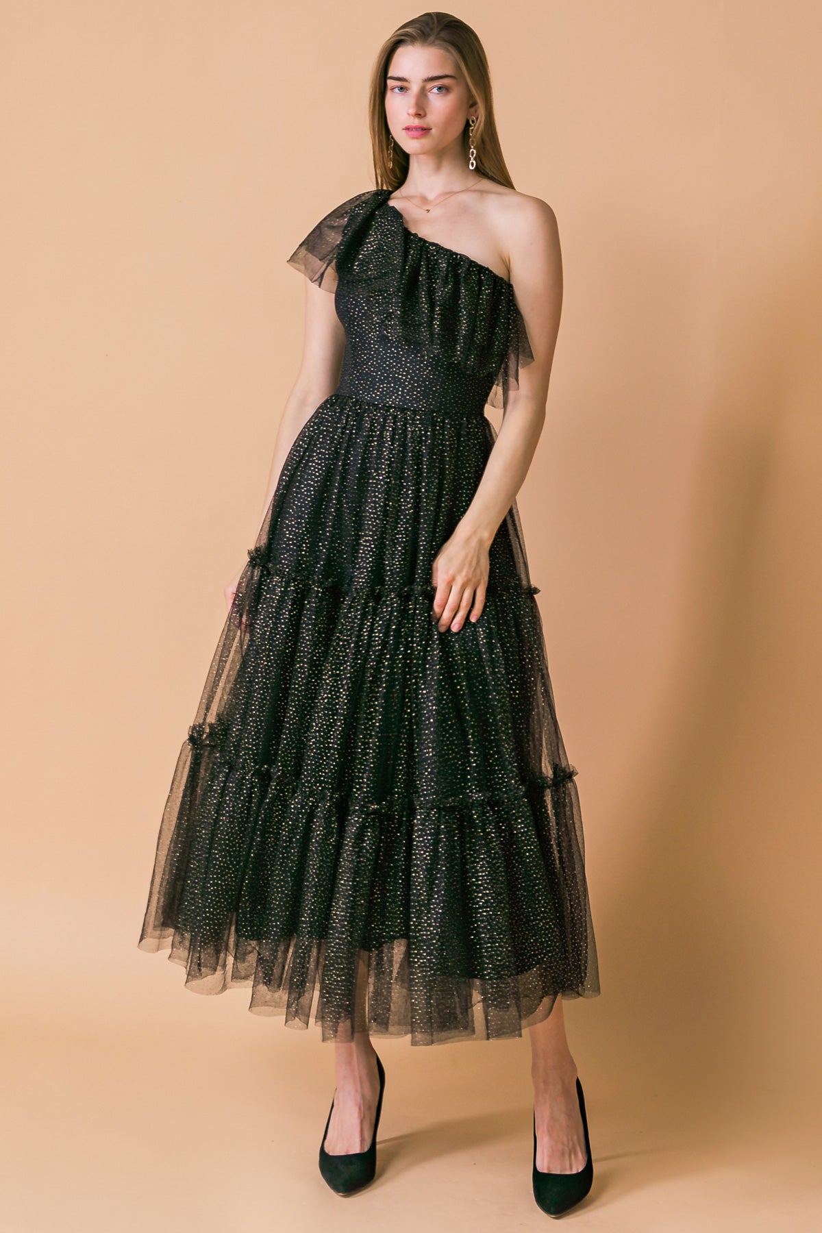 A tulle midi dress featuring one shoulder neckline with ruffles, tiered skirt and side zipper closure