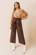 SHINING BRILLIANCE LEATHER WIDE LEG PANTS.