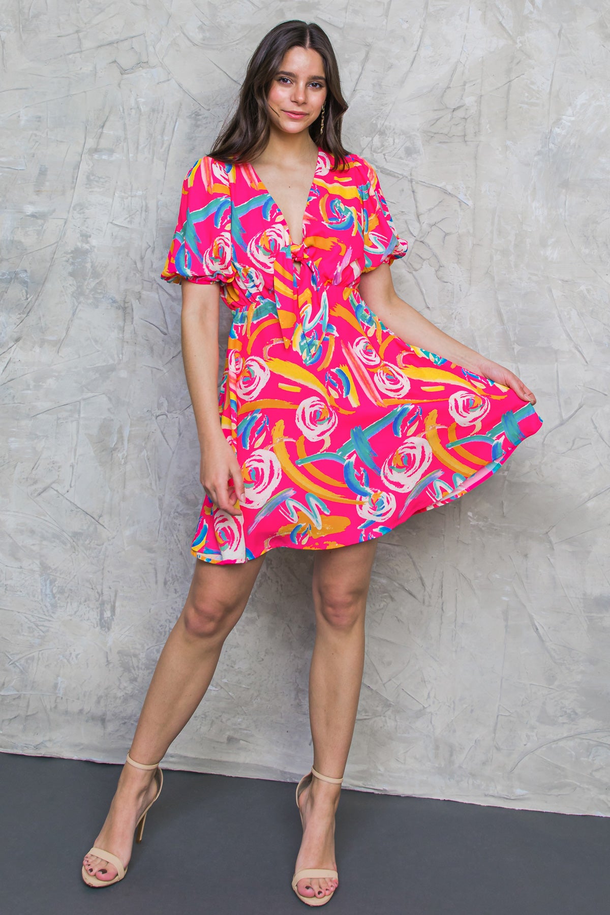 The WHERE WE WANNA GO WOVEN MINI DRESS is perfect for your next evening out. Its V-neckline and front-tie accent give it a beautiful touch, while its short puff sleeves and A-line skirt offer a flattering silhouette. Made with a lightweight woven fabric, it’s comfortable and stylish. It comes with a side zipper closure for ease of use.