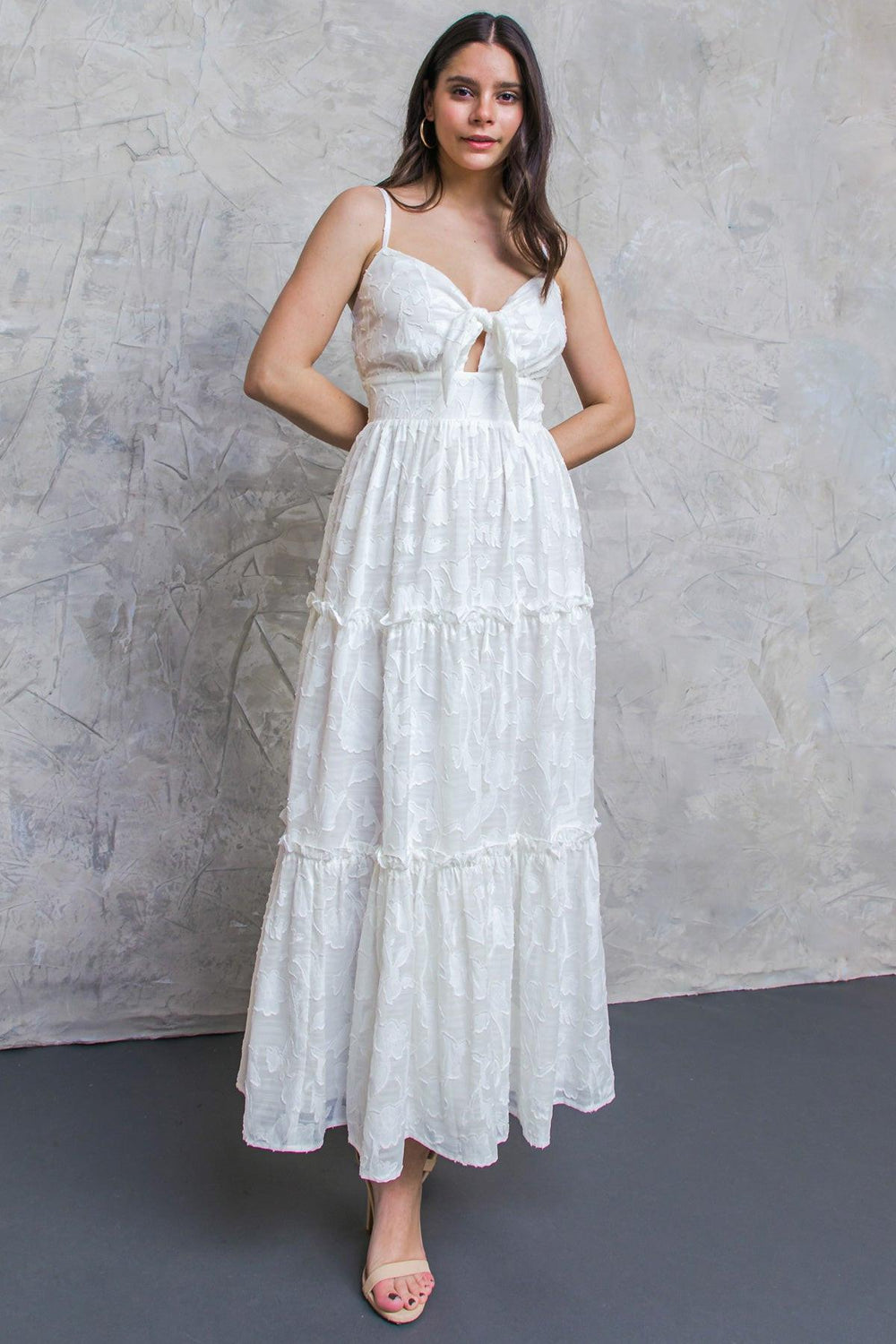 White long dress with knot-tie in the front on a white background | Flying Tomato